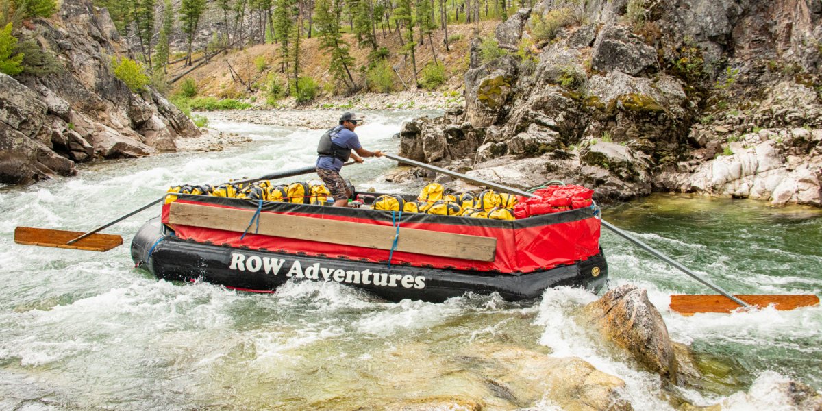 ROW Adventures Guide expertly guides the sweep boat down the Salmon river