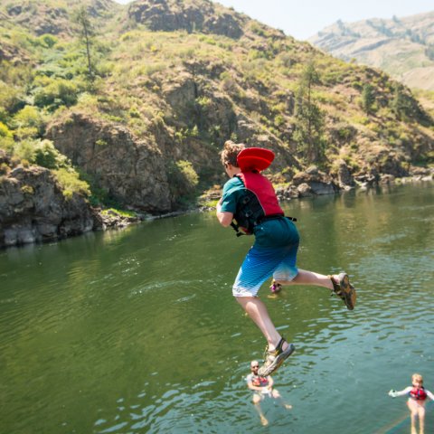 boy cliff jumping on the salmon river
