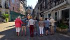 people on walking tour of french city