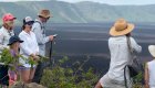 Family on tour in the Galapagos Islands on a volcano