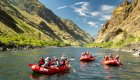 three red rafts on the snake river in idaho