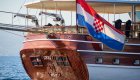 Croatian flag flying from back of sailing gulet in Croatia