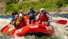 Red whitewater raft floating downstream on the Snake River through Hells Canyon 