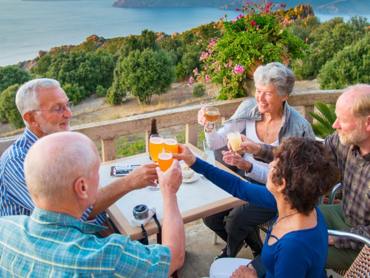 group toasting at a table in Corsica France